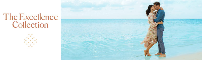 Couple on beach at Excellence Resorts