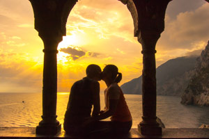 Couple kissing at sunset, Italy