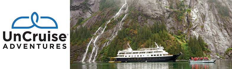 Uncruise near water fall in Alaska Fjord