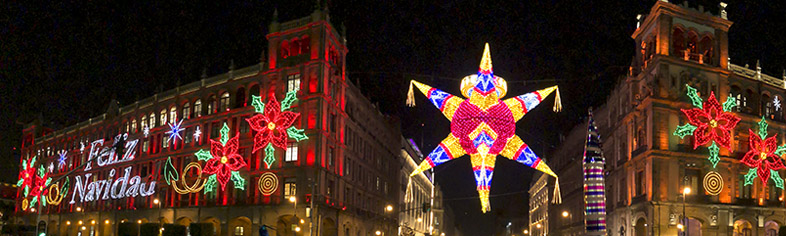 Festive Christmas lights on piñata and building in mexico