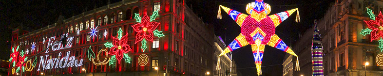 Festive Christmas lights on piñata and building in mexico