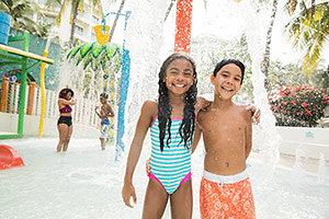 Family on beach, Sunscape Resorts